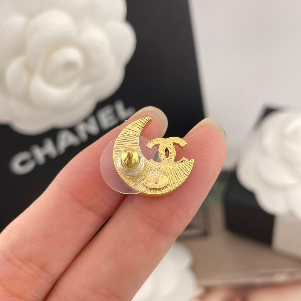 Crescent moon stud earring, gold-tone with CC motif and small rhinestone details