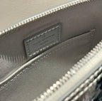 Louis Vuitton monogram handbag interior label plate beneath the top zipper