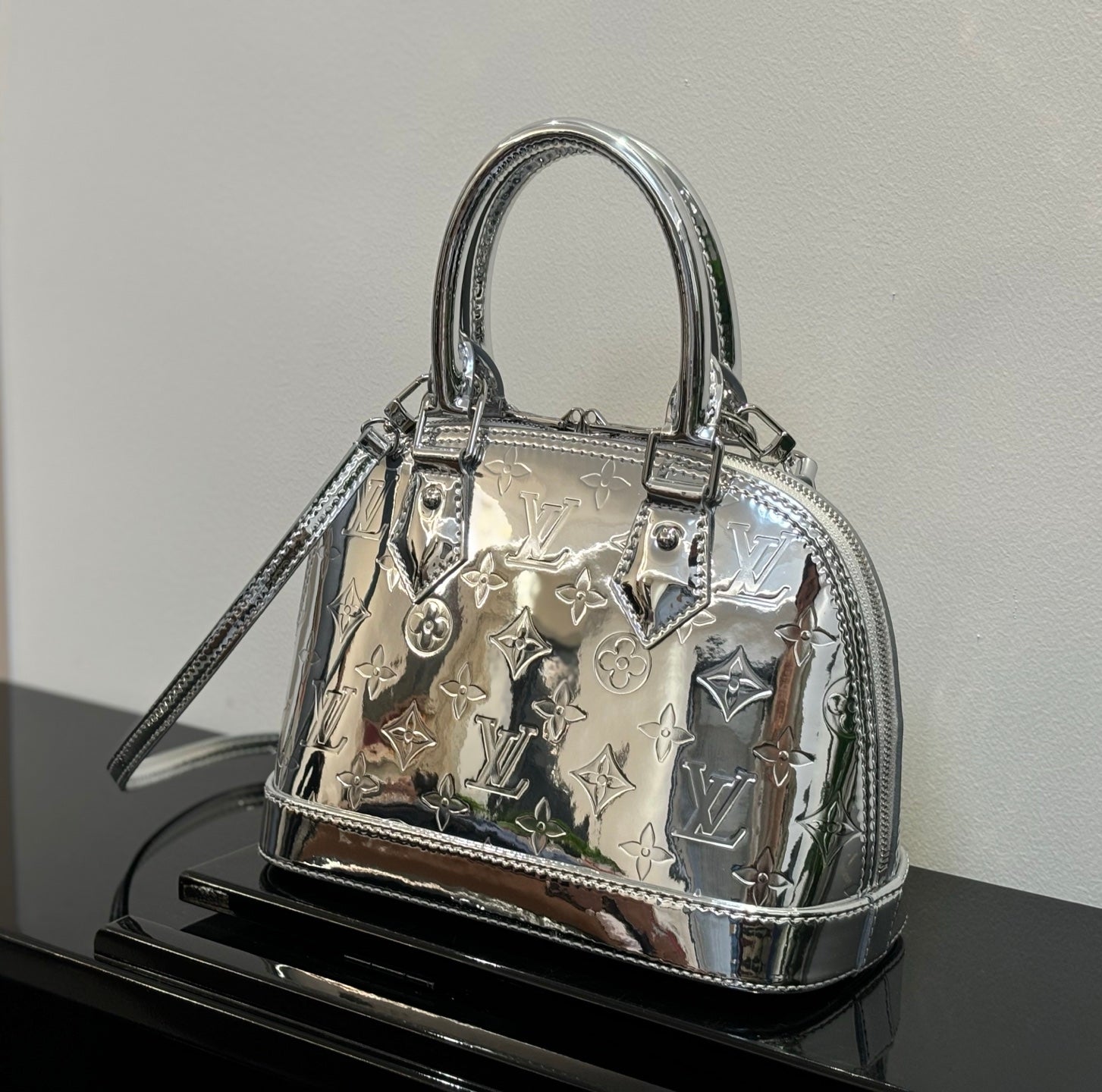 Louis Vuitton monogram handbag with top handles, silver-tone hardware and shoulder strap