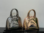 Louis Vuitton mini handbags in metallic silver and rose-gold tones, top handles and zipper