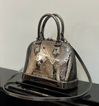 Louis Vuitton mini handbag in metallic silver with top handles and zipper closure