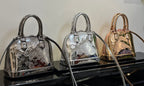 Louis Vuitton mini handbags trio in metallic silver and rose-gold tones, top handles