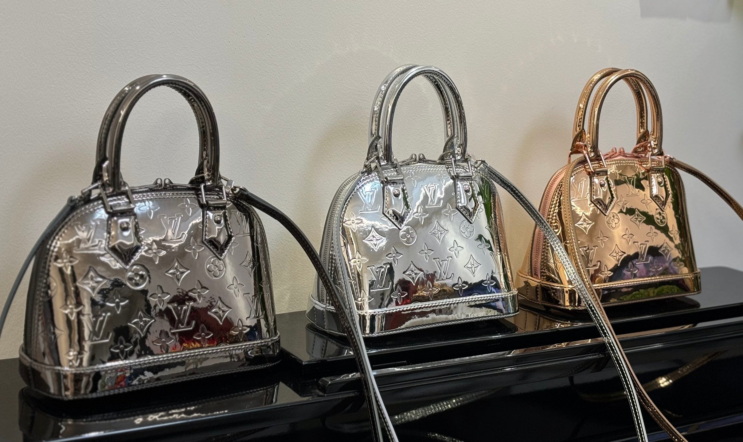 Louis Vuitton mini handbags trio in metallic silver and rose-gold tones, top handles