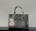 Louis Vuitton monogram tote bag with top handles, dark brown with metallic accents