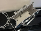 Louis Vuitton monogram handbag with zip closure and top handle, metallic silver and black trim