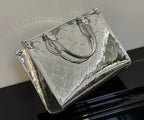 Louis Vuitton monogram handbag with top handle and shoulder strap, metallic silver finish