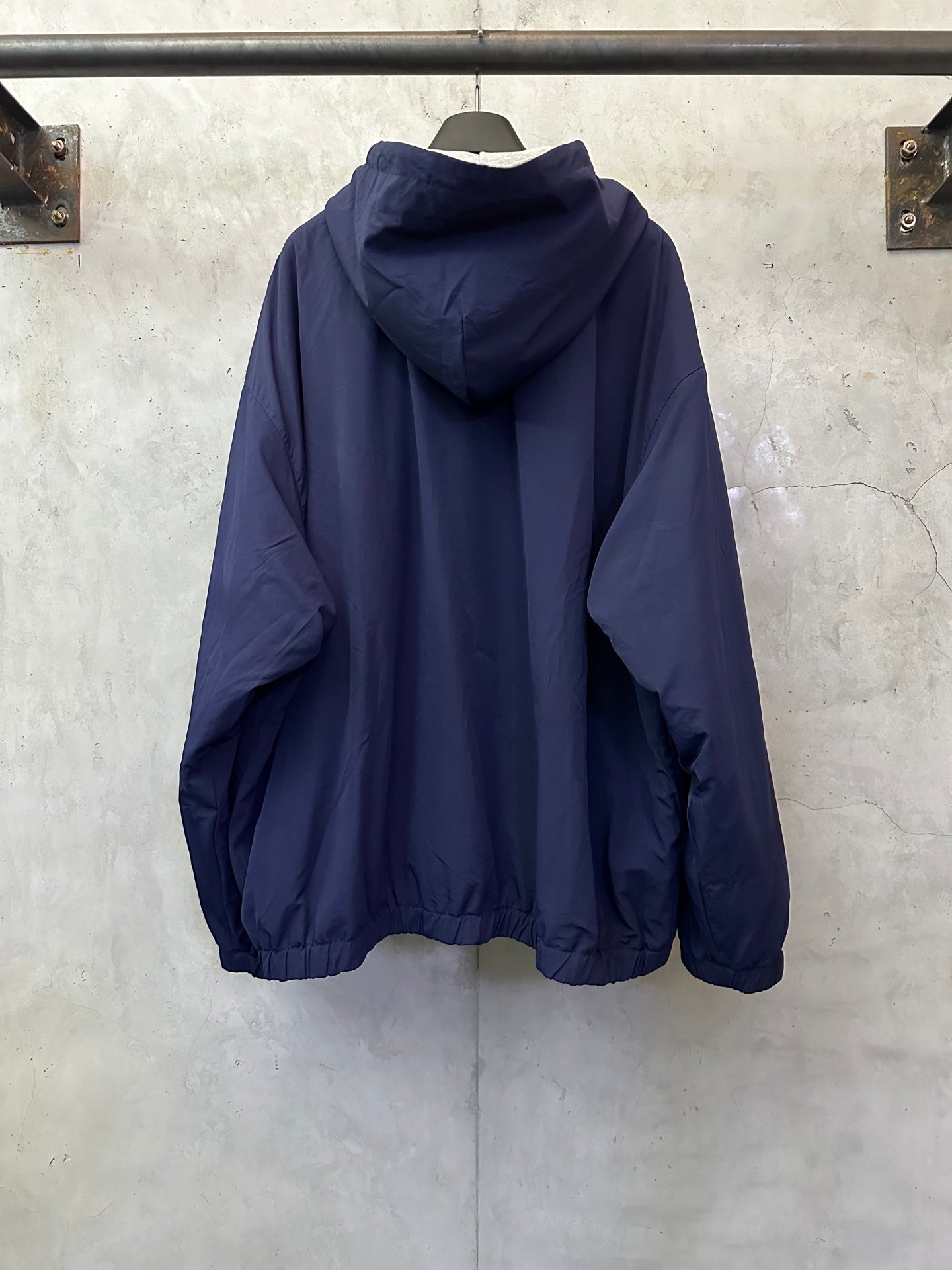 Balenciaga hooded jacket, navy blue, rear view with hood and elastic cuffs