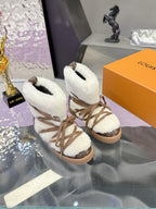 Louis Vuitton ladies faux-fur lace-up ankle boots, angled side view with brown laces