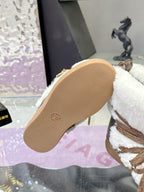 Louis Vuitton ladies faux-fur lace-up ankle boots, outsole view with logo embossed on sole