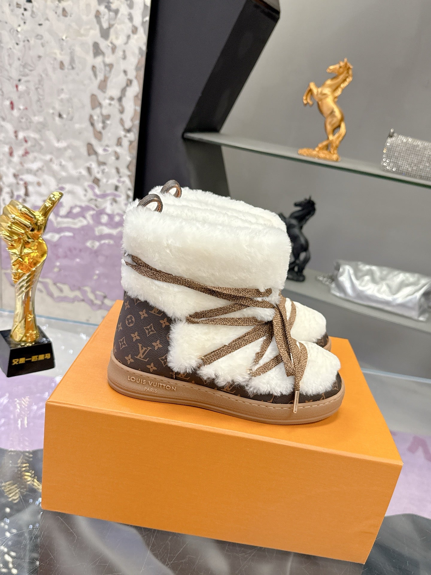 Louis Vuitton ladies faux-fur lace-up ankle boots, white upper with brown laces