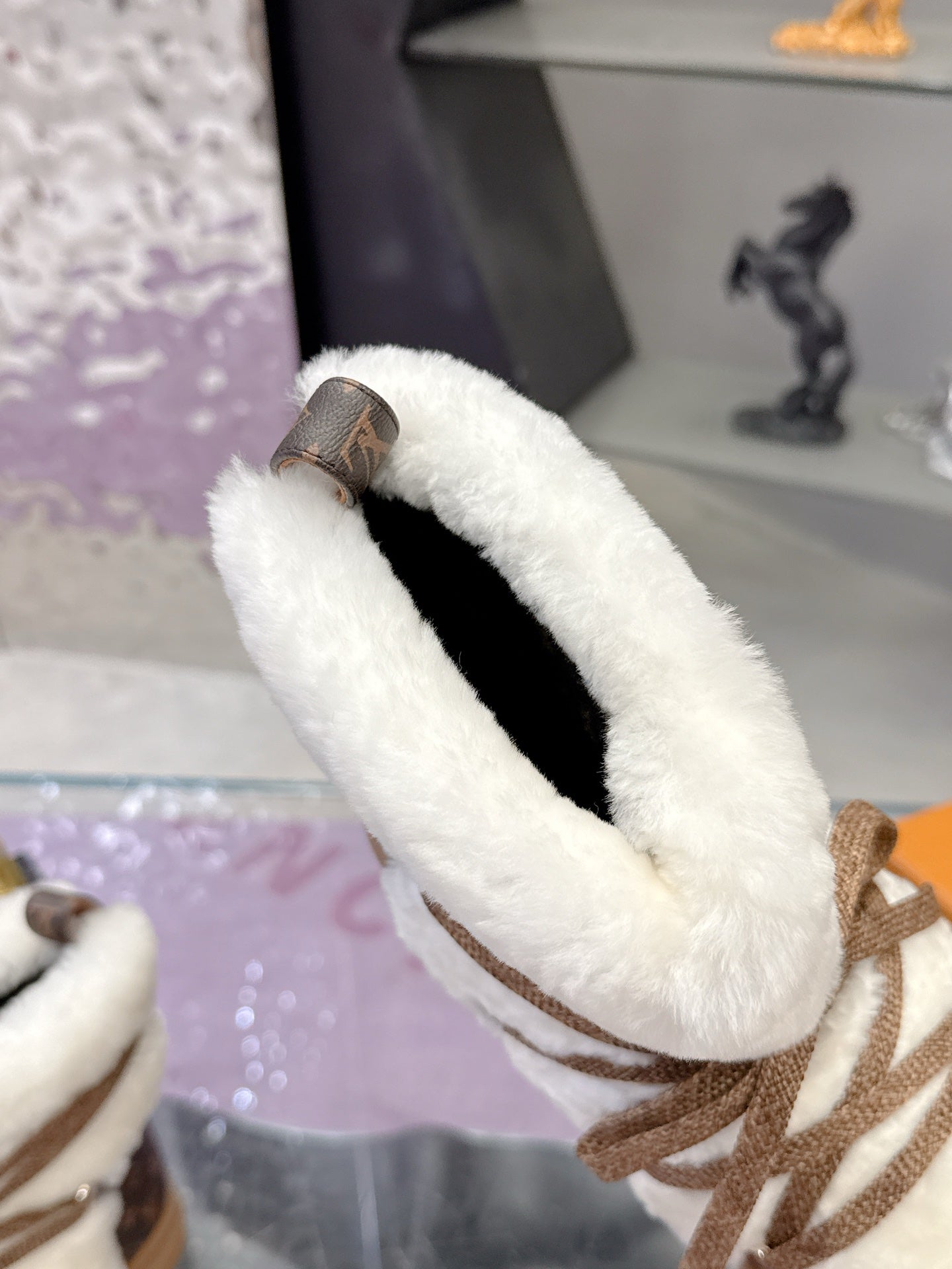 Louis Vuitton ladies faux-fur lace-up ankle boots, collar view with plush white lining