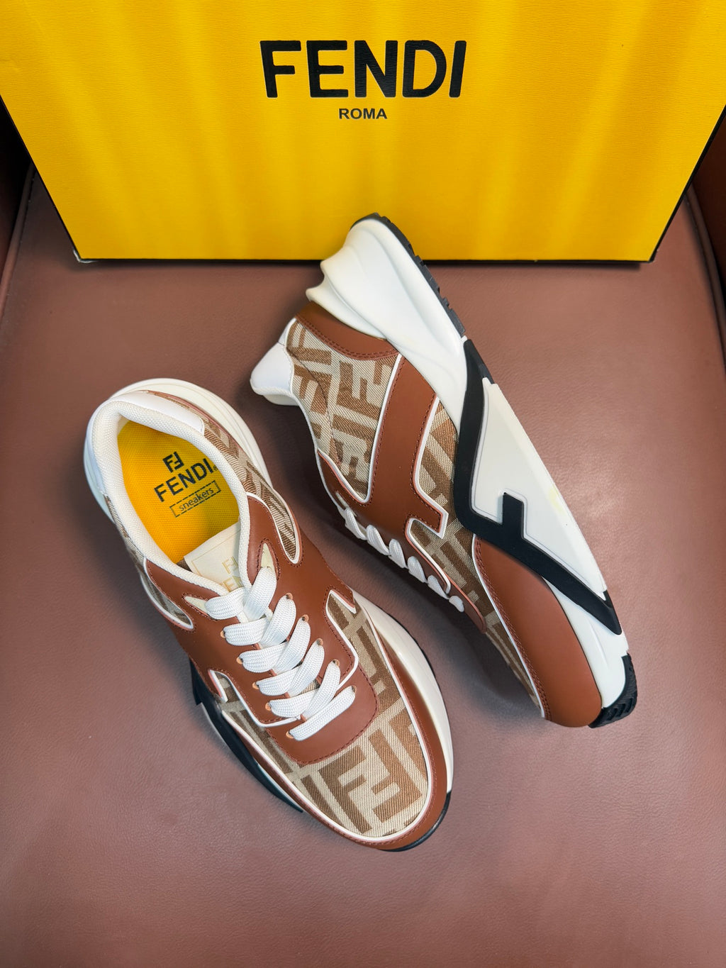 Fendi unisex sneakers, brown and tan with white laces, FF pattern, and logo stripe