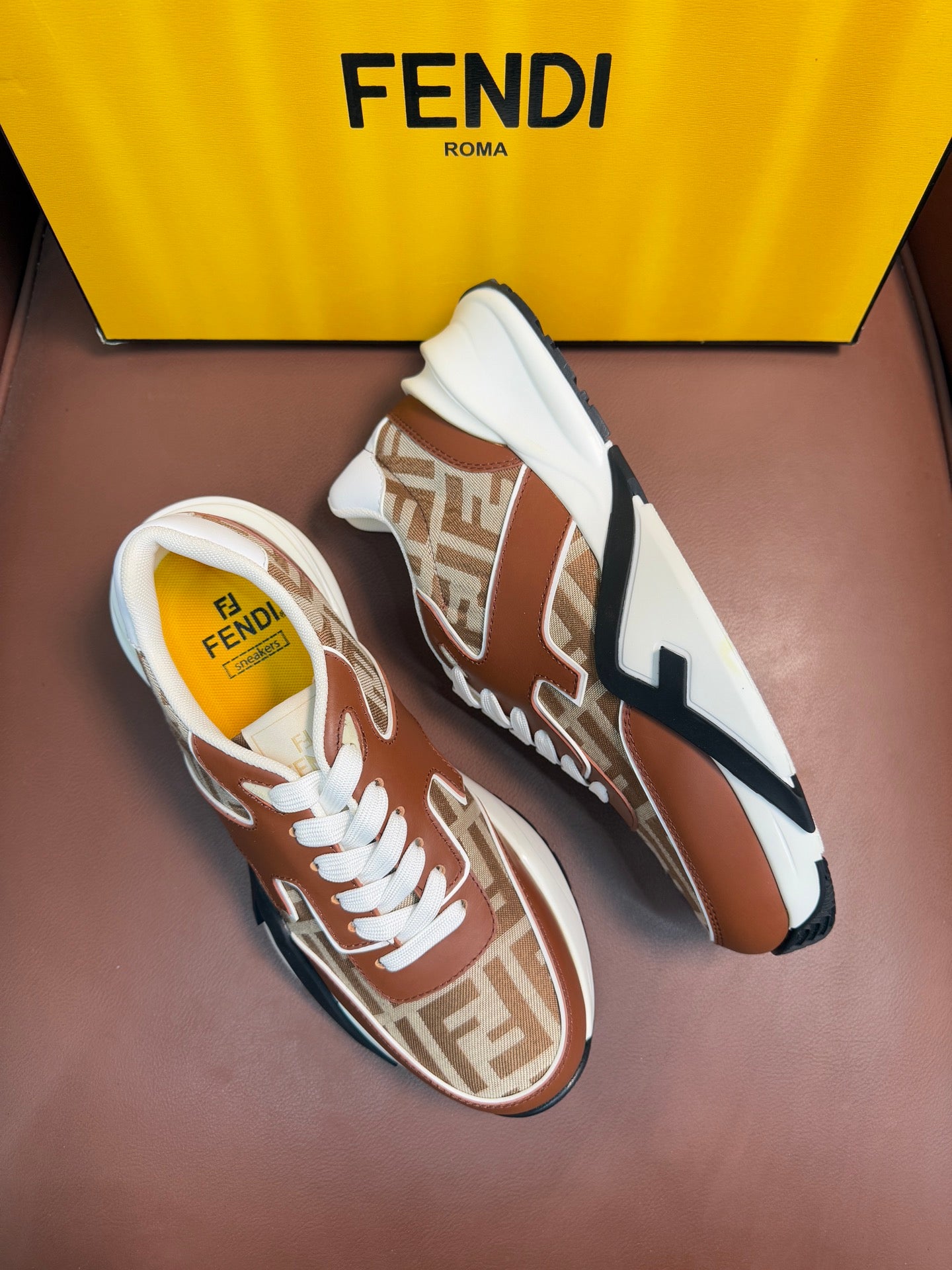 Fendi unisex sneakers, brown and tan with white laces, FF pattern, and logo stripe