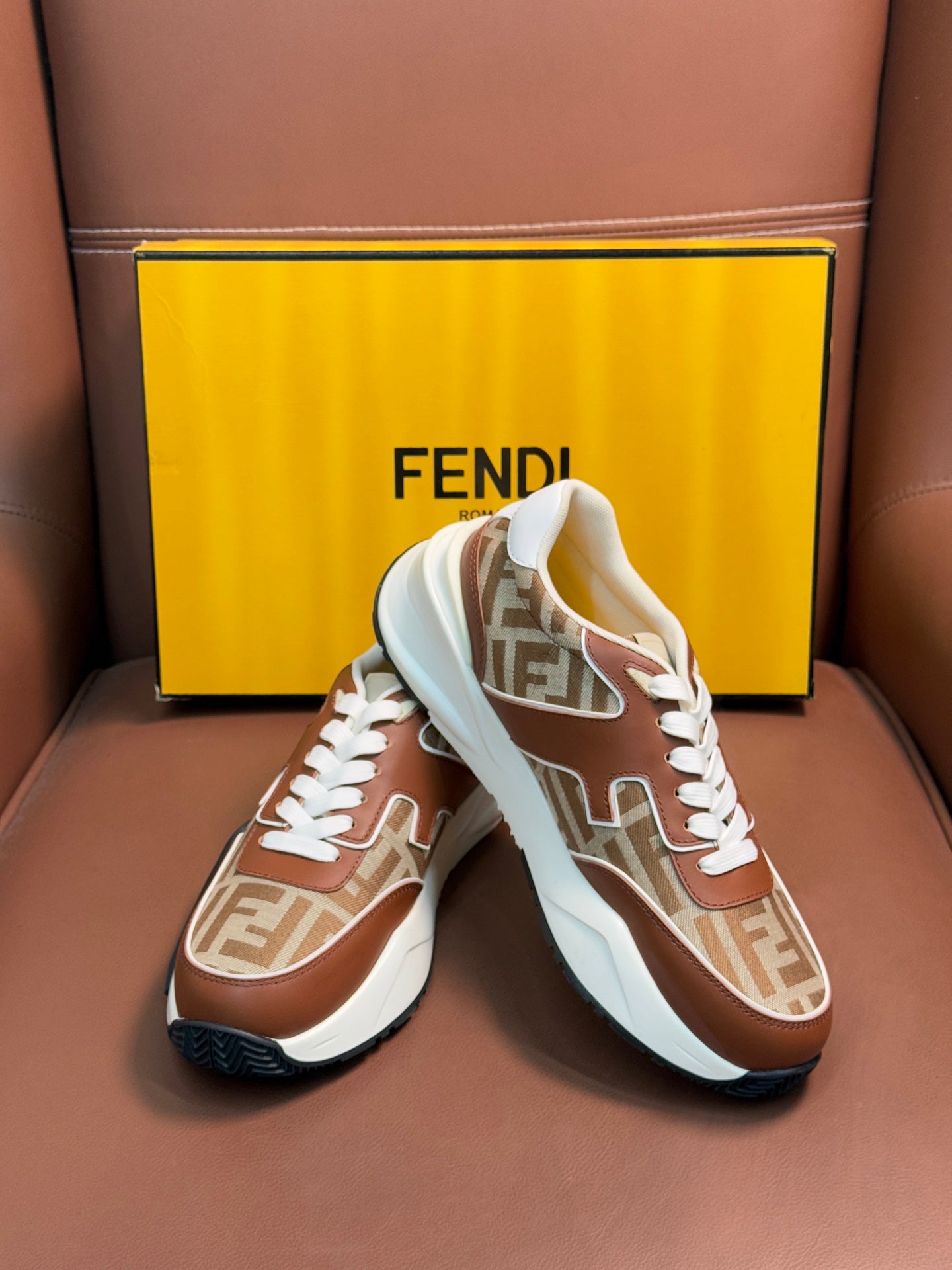 Fendi unisex sneakers in brown and tan with white laces and FF monogram uppers