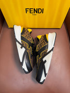 Fendi unisex sneakers pair with dark FF-motif fabric, yellow accents, and chunky white sole.