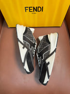 Black and gray Fendi unisex sneakers with white laces and bold side logo details.