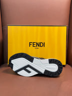 Fendi unisex sneakers outsole view, textured tread on white and dark rubber base.