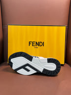 FENDI sneaker outsole with textured tread and dark rubber pods under the white shoe.