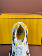 White lace-up sneaker with blue FF logo and yellow heel tab, cushioned collar.