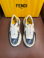 White and blue FF logo low-top sneakers with yellow accents, lace-up, chunky sole.