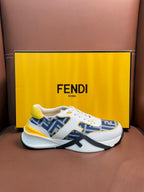 White FENDI sneakers with blue FF logo uppers and yellow accents, lace-up, chunky sole.