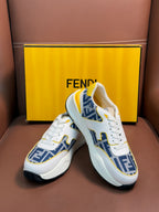 White FENDI sneakers with blue FF side stripe, yellow collar lining, lace-up.