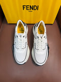 White Fendi sneakers with black logo detailing, lace-up design