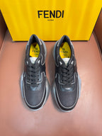 Fendi unisex sneakers, dark gray lace-up with perforated toe and chunky white sole.