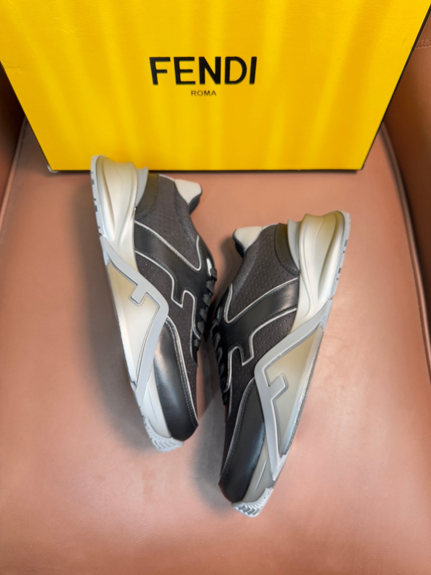 Fendi unisex sneakers, dark gray lace-up with light gray accents and white outsole.