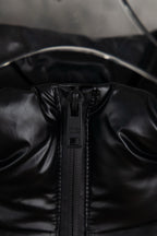 Prada long puffer jacket close-up of front zipper and hood seam detail
