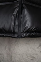 Prada long puffer jacket close-up of center zipper and stitched quilted seams