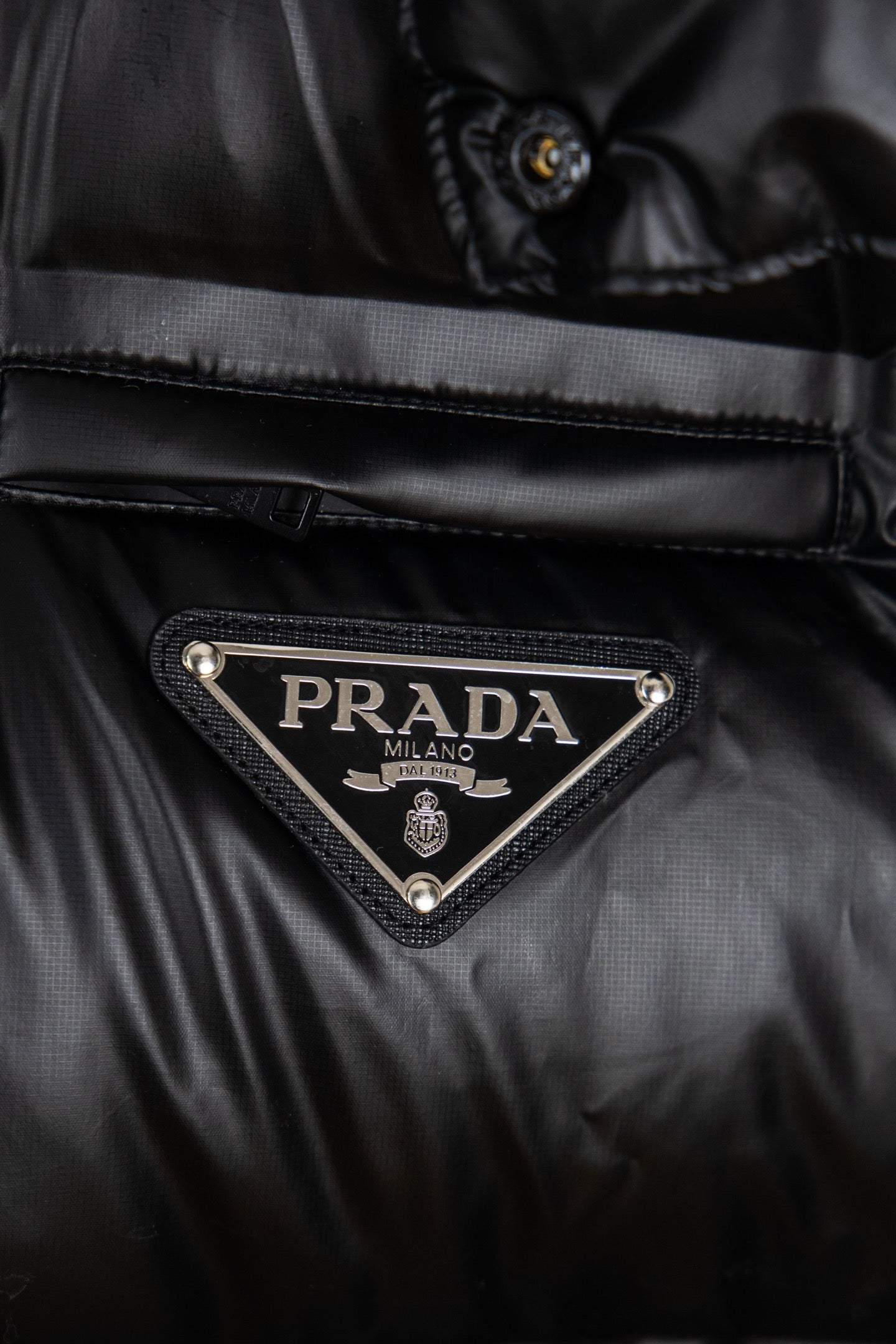 Prada long puffer jacket logo triangle patch on the chest