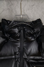Prada long puffer jacket front with hood, black zipper placket, and stitched panels