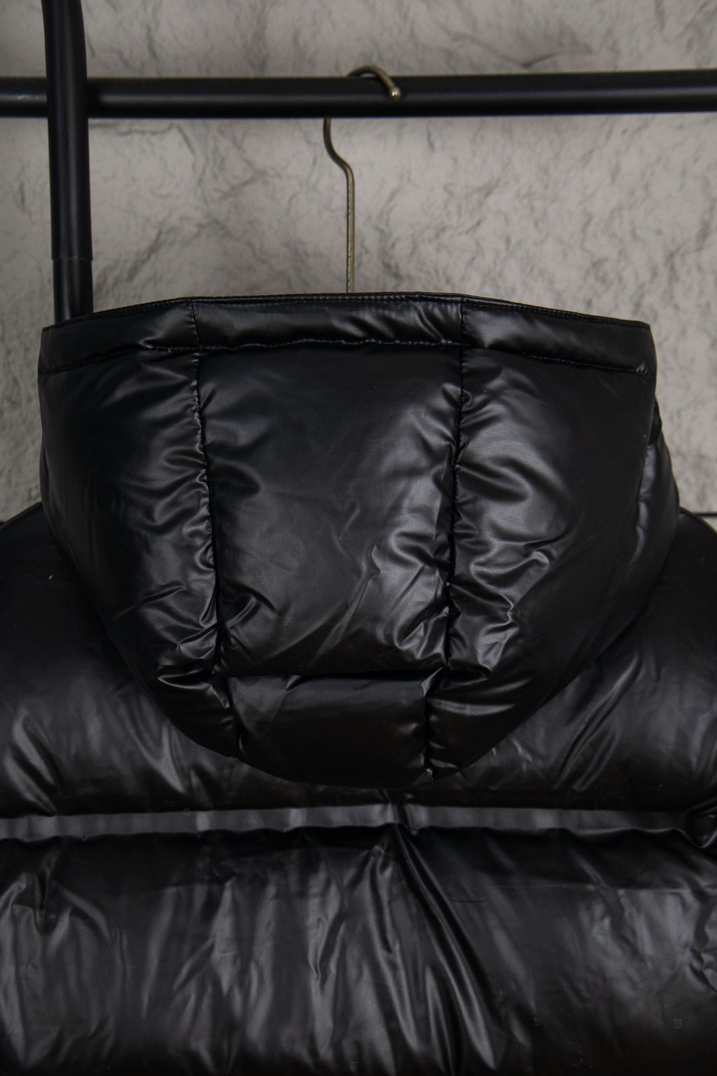 Prada long puffer jacket in dark black with front zipper and quilted panels