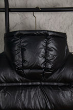 Prada long puffer jacket in dark black with front zipper and quilted panels