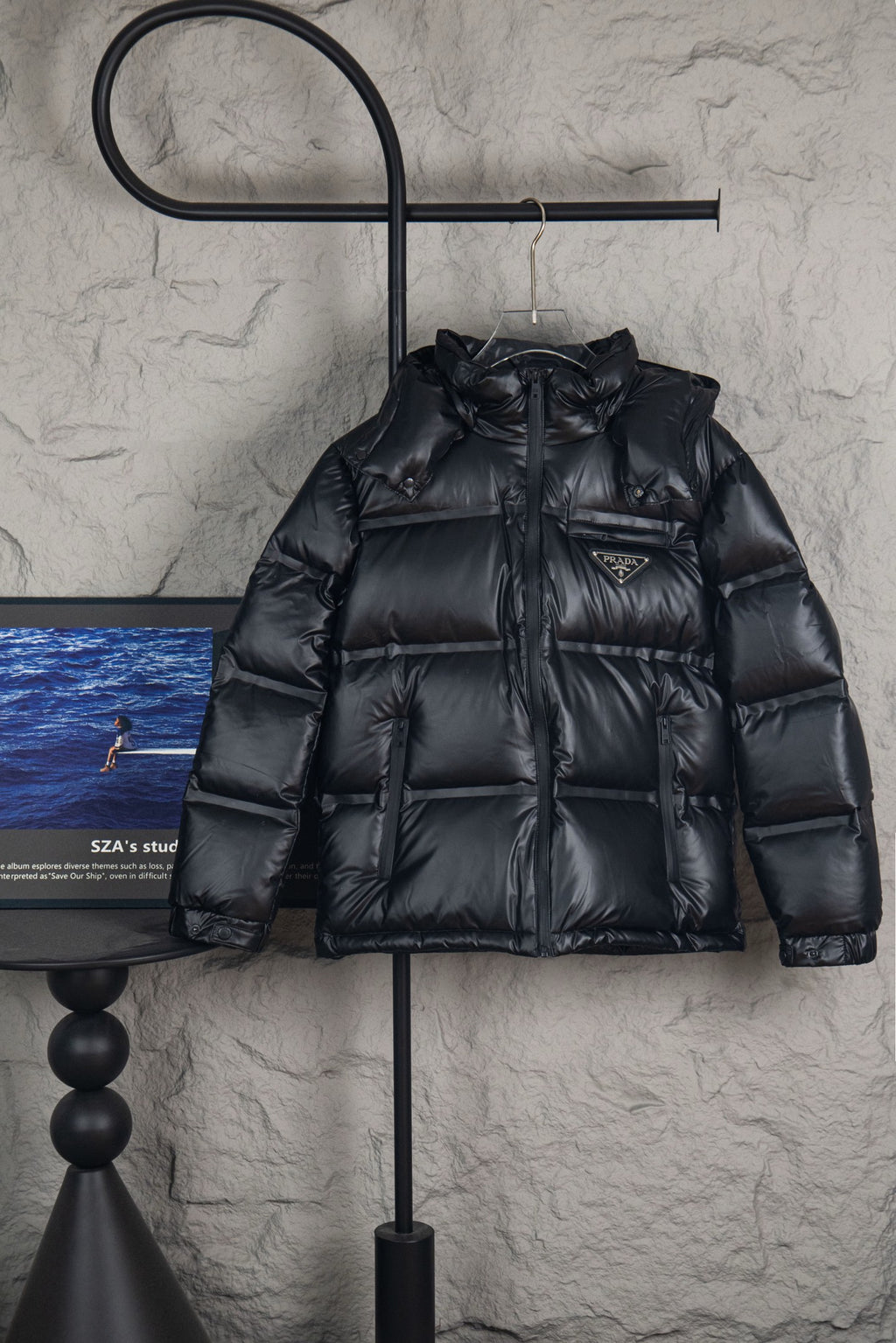 Prada long puffer jacket with hood, front zipper, and quilted black shell