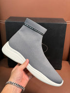 Prada unisex sock sneakers close-up, light gray knit with branded cuff strip