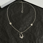 Silver-tone Dior charm necklace with central oval link and logo drop pendant
