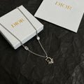 Silver-tone Dior charm necklace with oval gem links and logo pendant