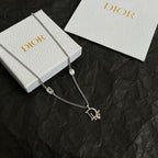 Silver-tone Dior charm necklace with oval gem links and logo pendant