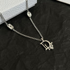 Silver-tone Dior charm necklace with large D logo pendant and oval gem links