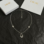 Silver-tone Dior logo charm necklace with three round gem pendants