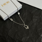 Silver-tone Dior charm necklace with two gem-set logo pendants