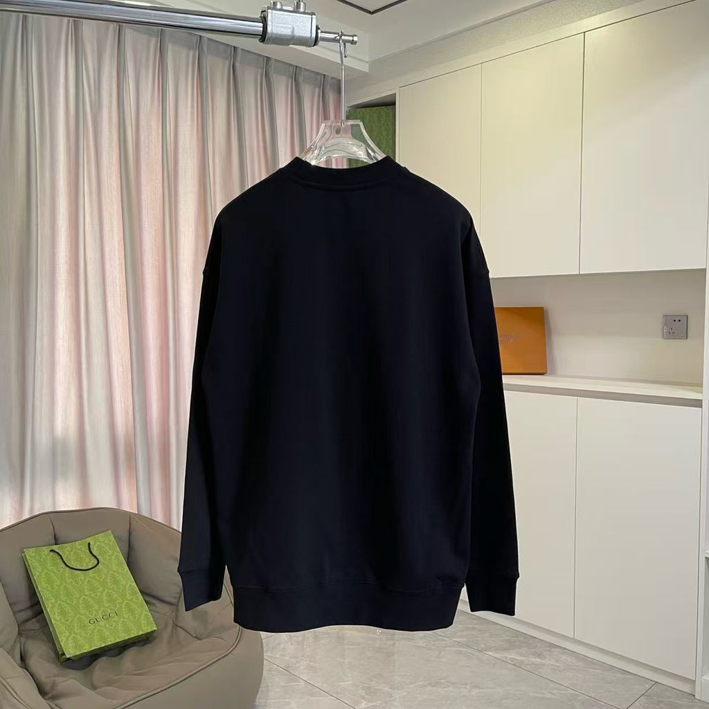 Long-sleeve crewneck sweatshirt, black, plain back view on hanger.