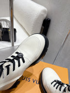 Louis Vuitton white high-top shoe side, black laces and stitched toe detail