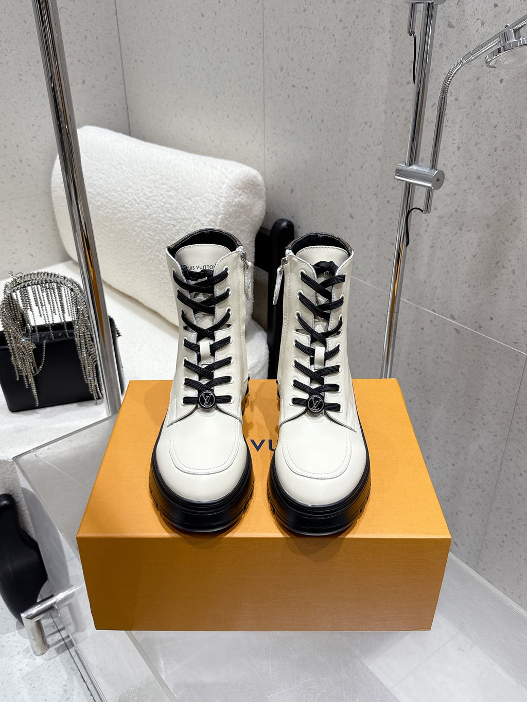Louis Vuitton white high-top shoes with black laces on box