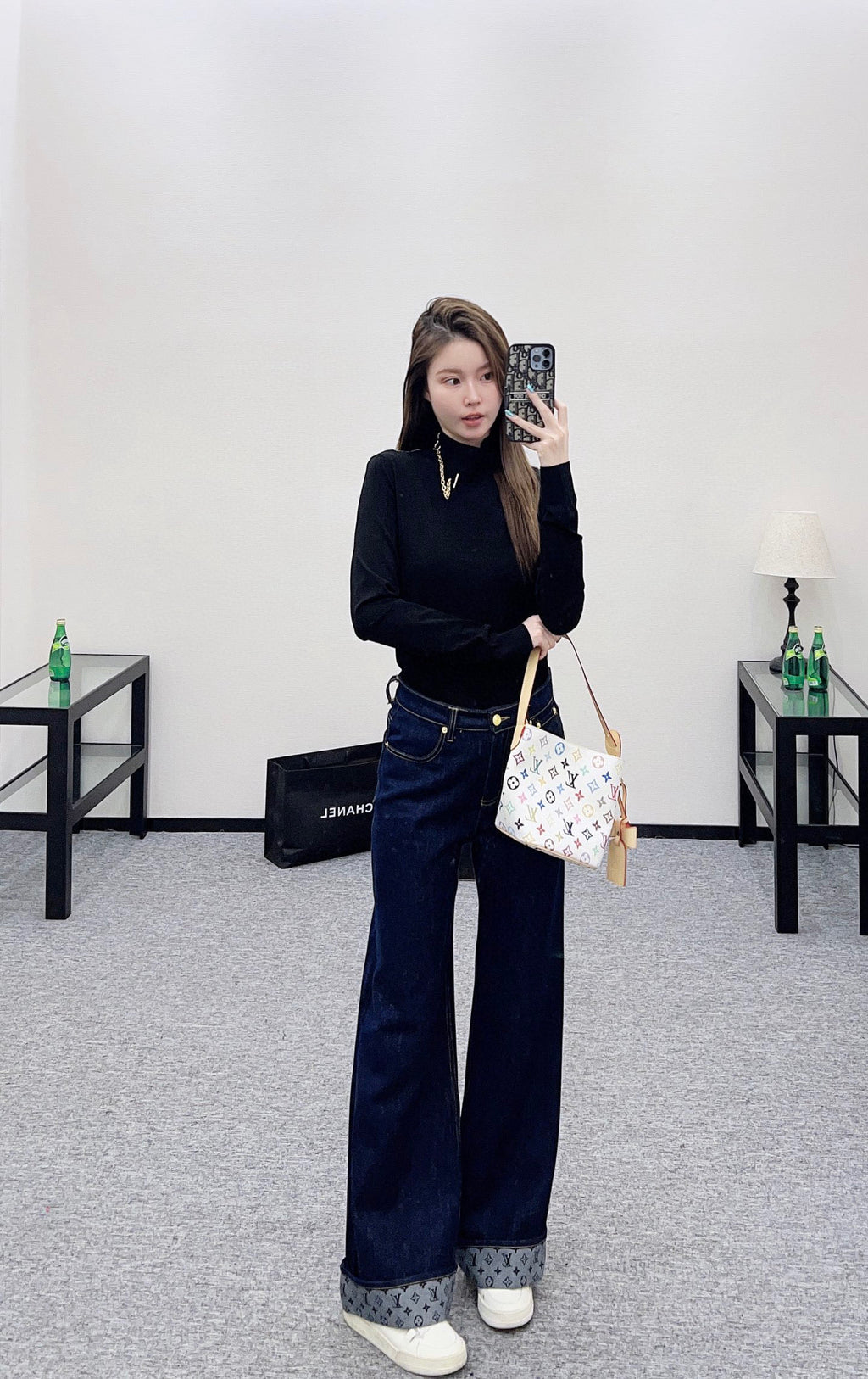 Louis Vuitton black long-sleeve mock-neck top with gold chain necklace detail