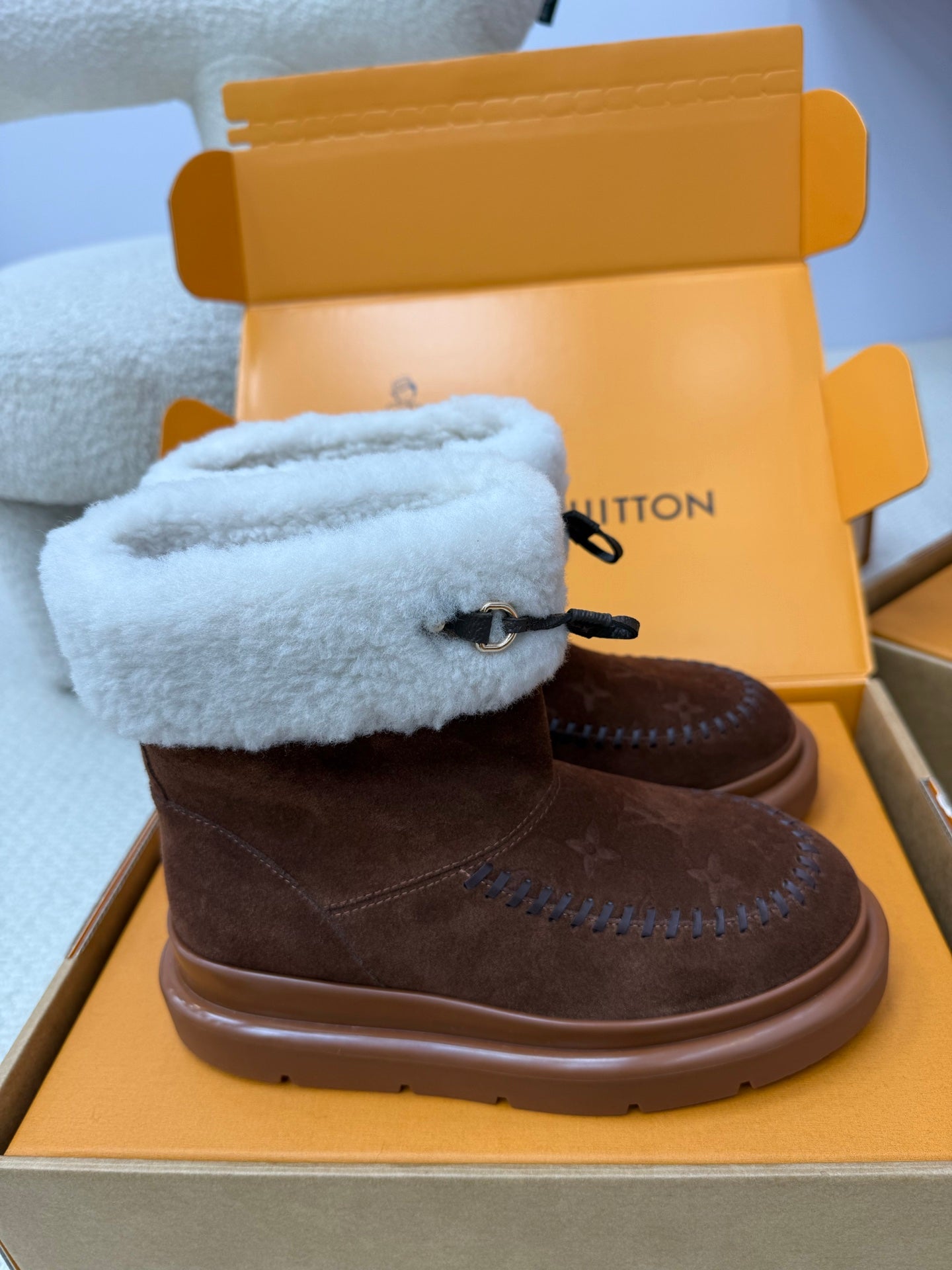 Louis Vuitton ladies shoes, brown suede with light blue shearling cuff and lace tie, rounded platform sole.