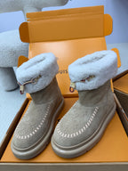 Louis Vuitton women's gray suede boots with light blue shearling cuffs and buckled straps