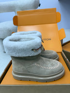 Louis Vuitton women's gray suede boots with light blue shearling cuff, side stitching, and strap